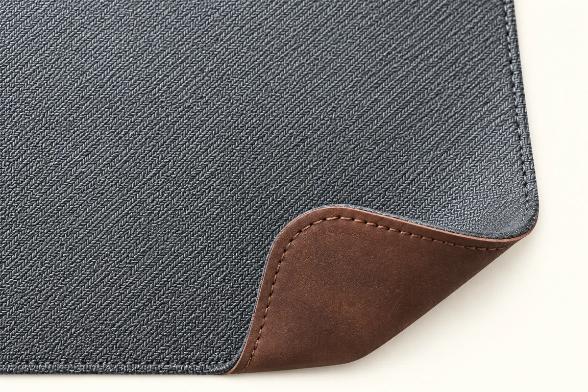 Back of the desk pad: woven non-slip base with leather corner