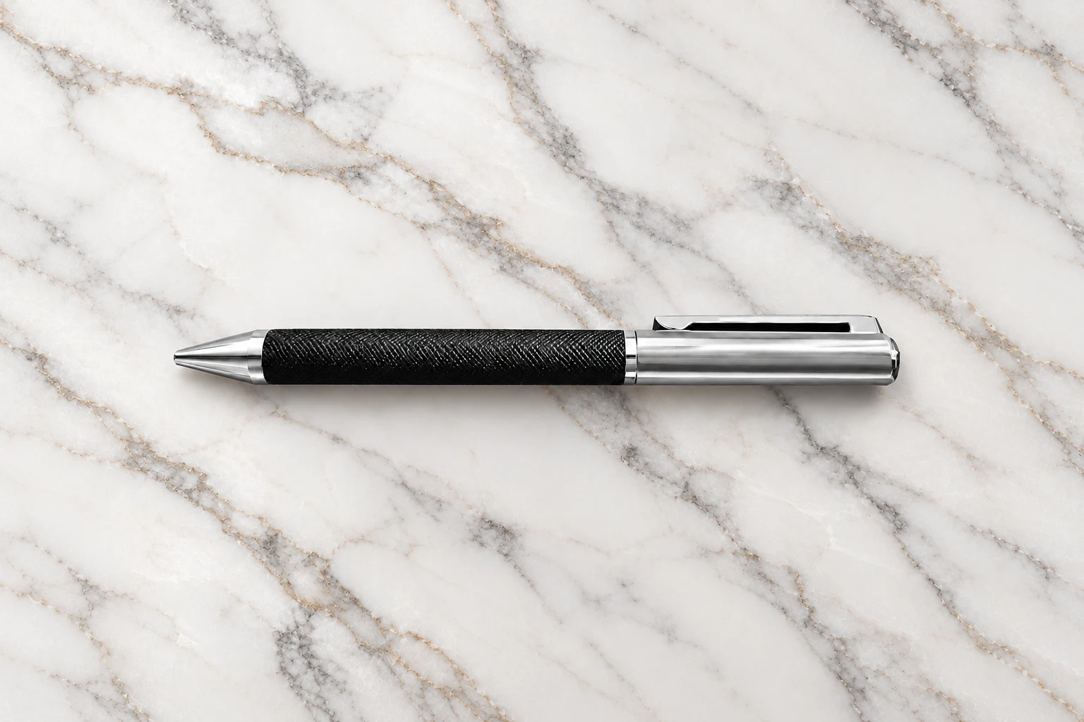 Executive metal pen with black textured grip and brushed steel cap